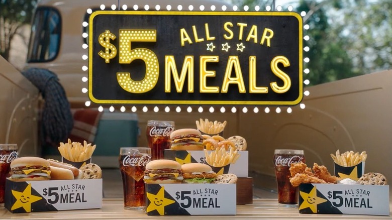 Lit up Marquee sign that says $5 All-Star meals over four box meals featuring various hamburgers, sandwiches, fries, drinks, cookies, and more