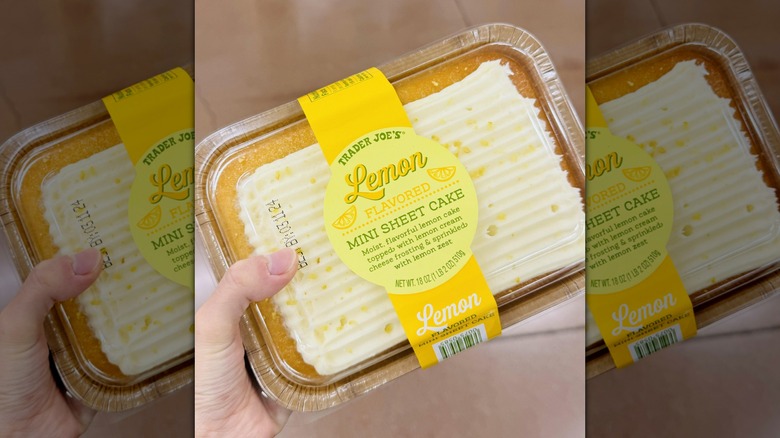 A hand holding Trader Joe's Lemon Mini Sheet Cake