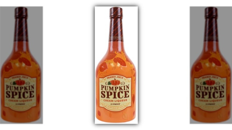 A closeup of Trader Joe's Pumpkin Spice Cream Liqueur in a bottle on a white background