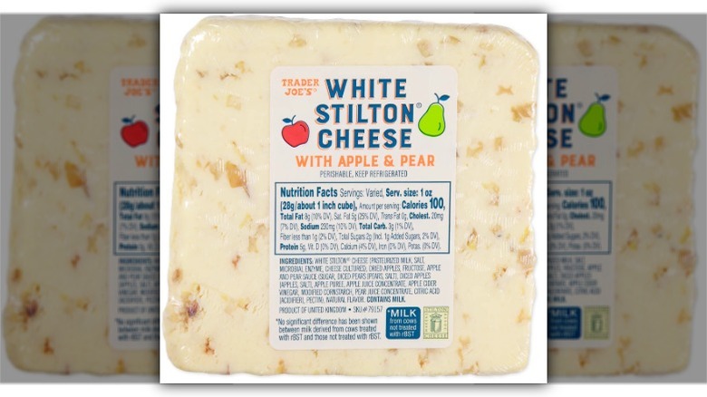 A closeup of Trader Joe's White Stilton Cheese with Apple & Pear on a white background