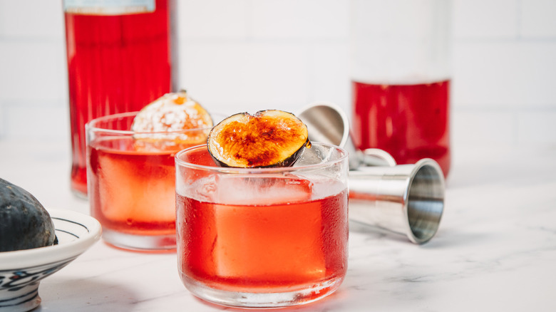 Fig negroni with bottles in background