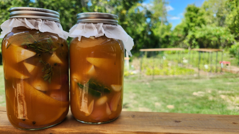 Two large mason jars filled with homemade fire cider