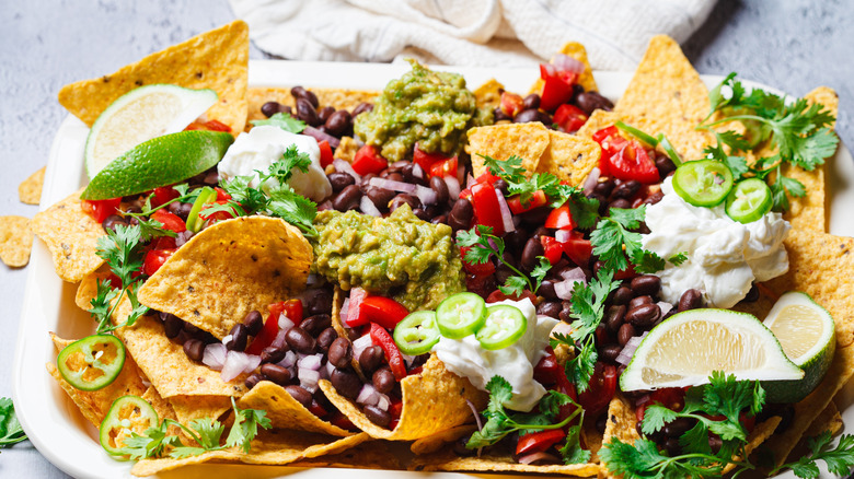 Plate of loaded nachos close-up