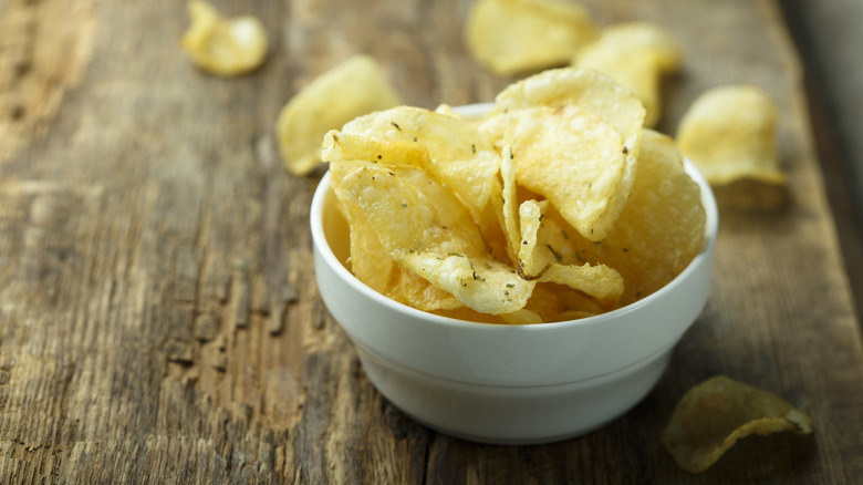 A white bowl of kettle cooked potato chips