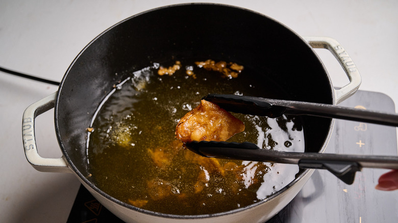 frying fish in hot oil