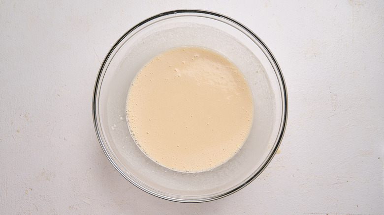 beer added to bowl to form a batter