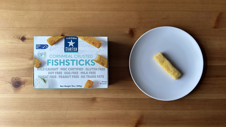 Starfish Cornmeal Crusted Fish Stick on white plate with box