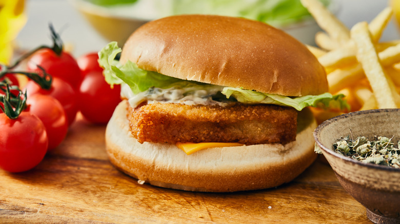 Fried fish sandwich on cutting board