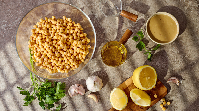 Overhead view of hummus ingredients on a table