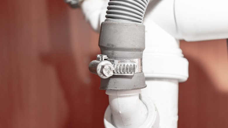 close up of dishwasher hose connection