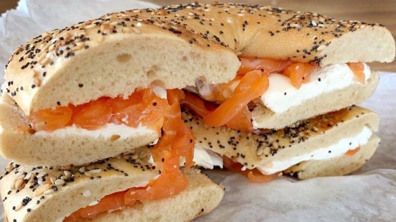 Closeup of a cut flagel with cream cheese and lox