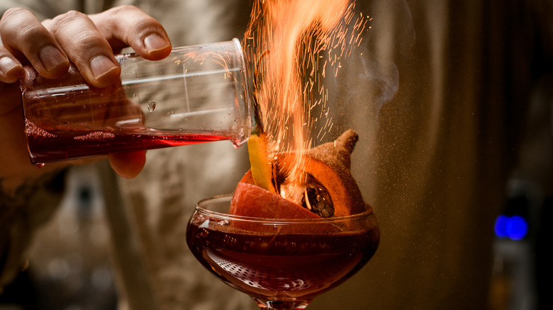 Flaming cocktail in glass 