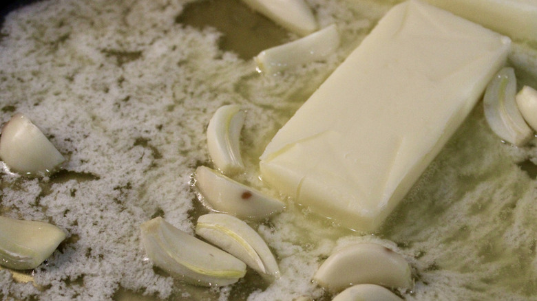Melting butter with garlic in a pan