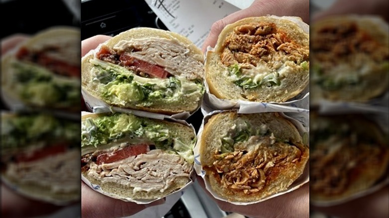 Four halves of meaty sandwiches from Buccan