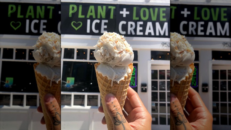 Toasted coconut ice cream cone with a sign in the background