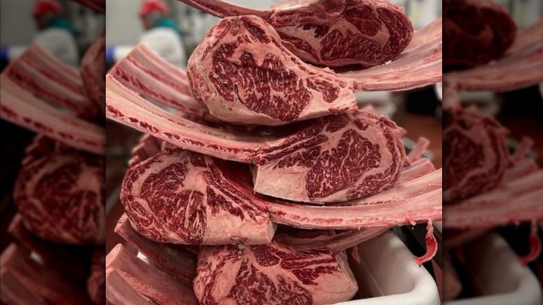 Tower of raw tomahawk ribeyes.