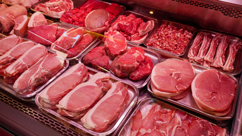 Butcher case of raw meat cuts
