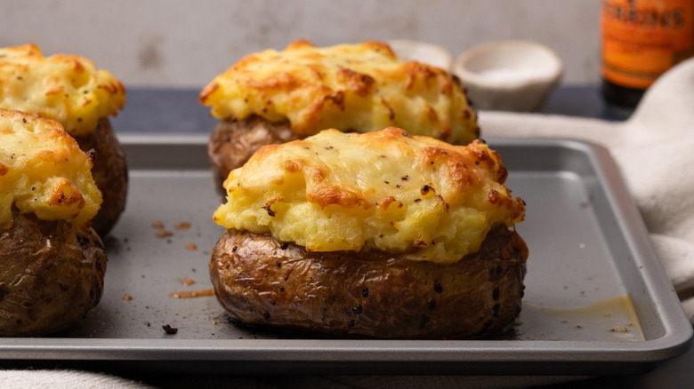 cottage pie baked potatoes on tray