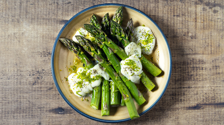 bowl of asparagus with ricotta cheese