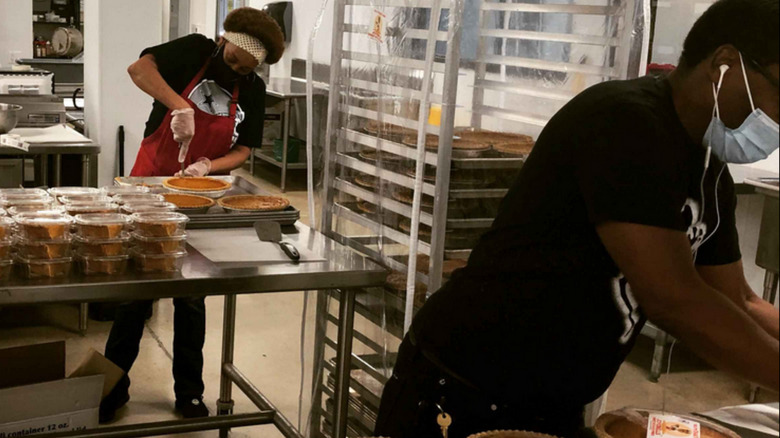 bakery workers at Joyebells' small-scale production facility, packaging baked pies
