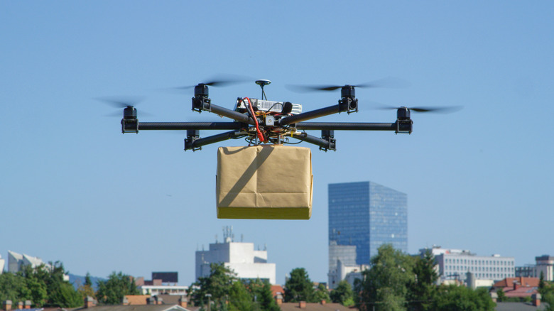 A drone delivers a package in a city