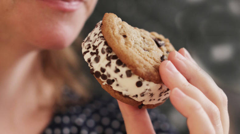 Person eating an ice cream sandwich