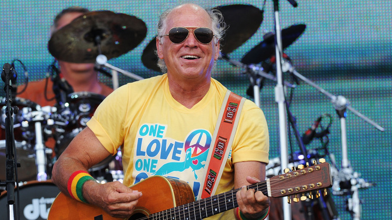 Jimmy Buffett performing on stage