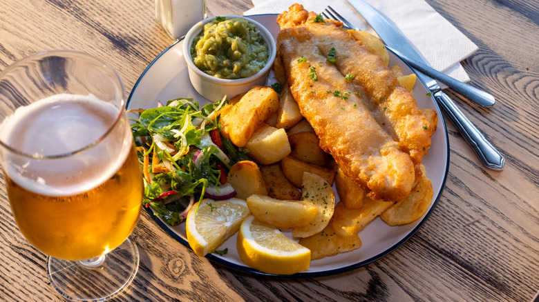 Fish and chips with beer on table