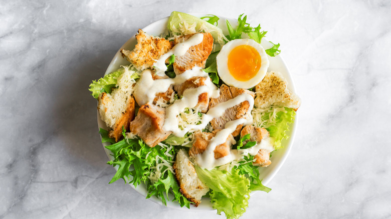 Caesar salad with eggs and chicken