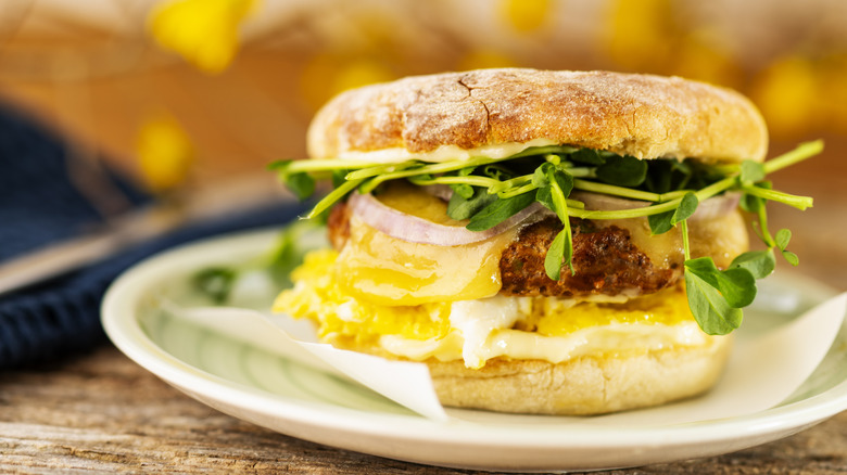 Breakfast sandwich with greens sausage and egg