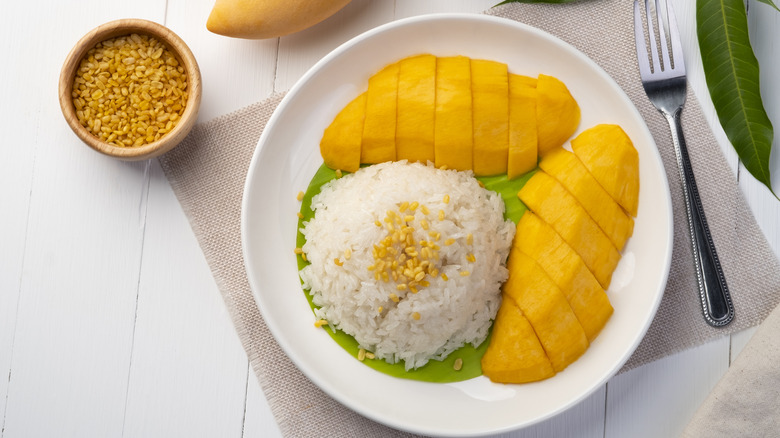 mango sticky rice on a white plate 
