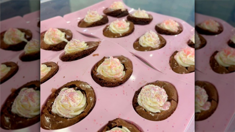Deviled brownies with frosting in a tray