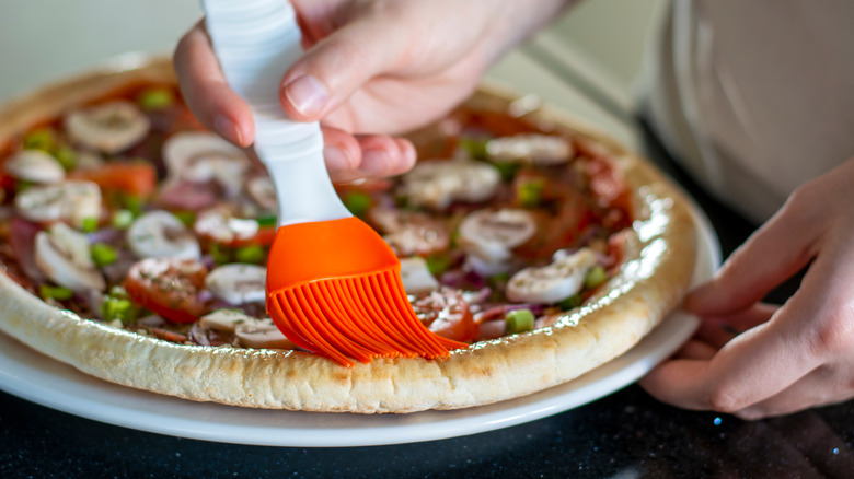 https://www.tastingtable.com/img/gallery/for-better-frozen-pizza-crust-brush-it-with-some-olive-oil/intro-1698327274.jpg