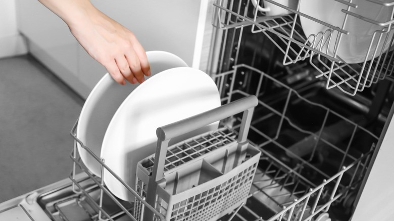 loading dishes in dishwasher