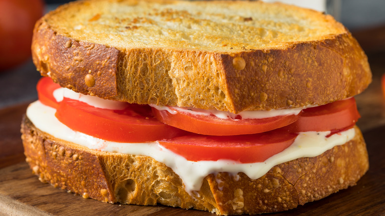 A toasted tomato sandwich with mayo