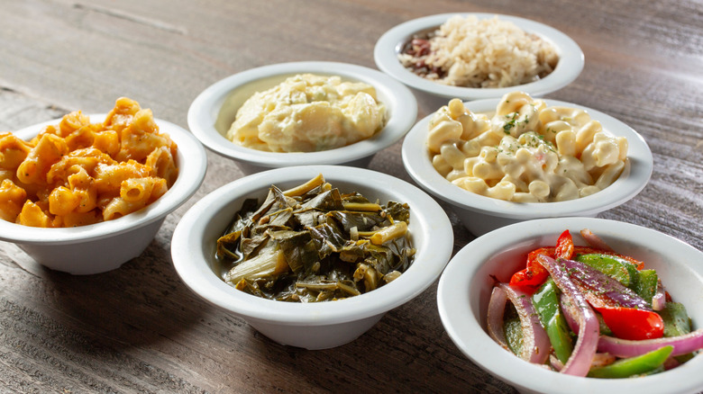 assortment of side dishes in white bowls