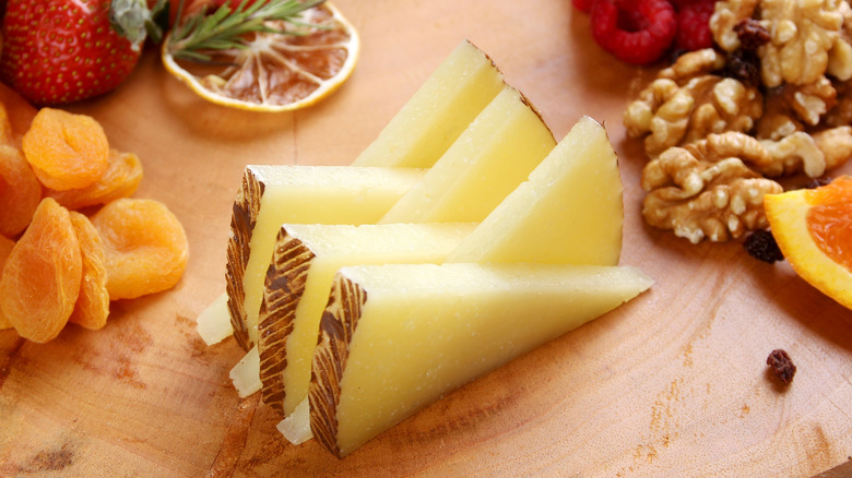 Manchego wedges on a board