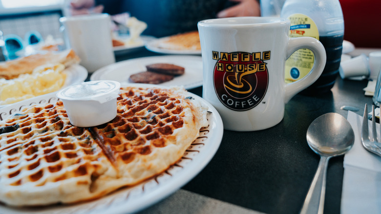 waffle house waffle on plate with syrup and coffee mug