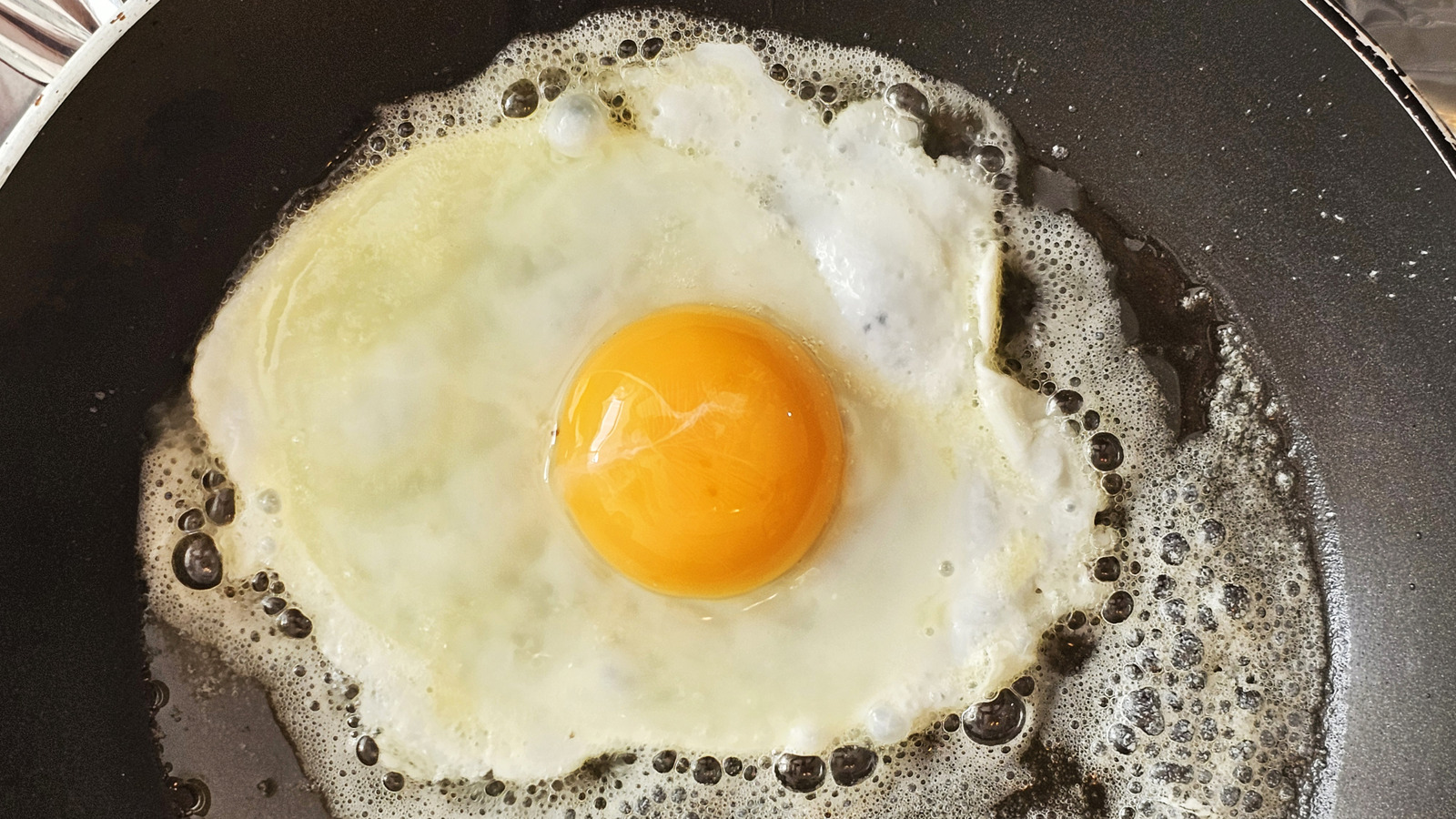 For Fried Eggs Bursting With Flavor, Add A Little Of This To Your Pan