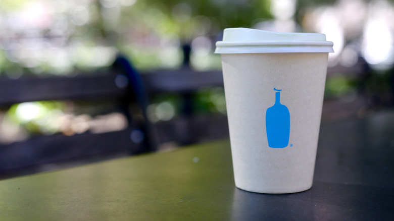 A matcha latte from Blue Bottle in a to go cup
