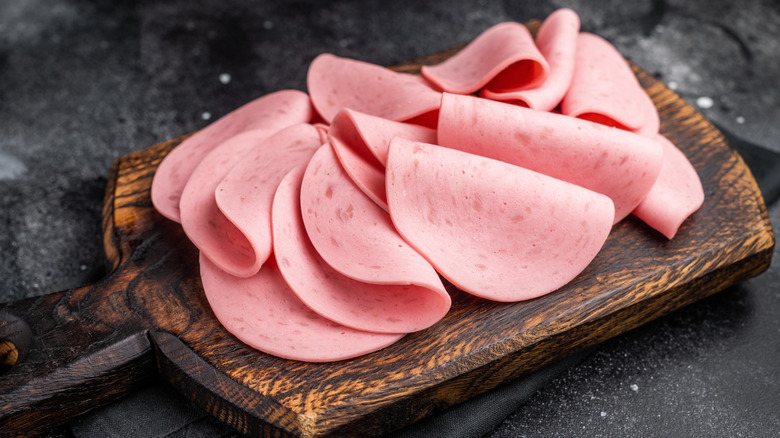 bologna slices on a wood board