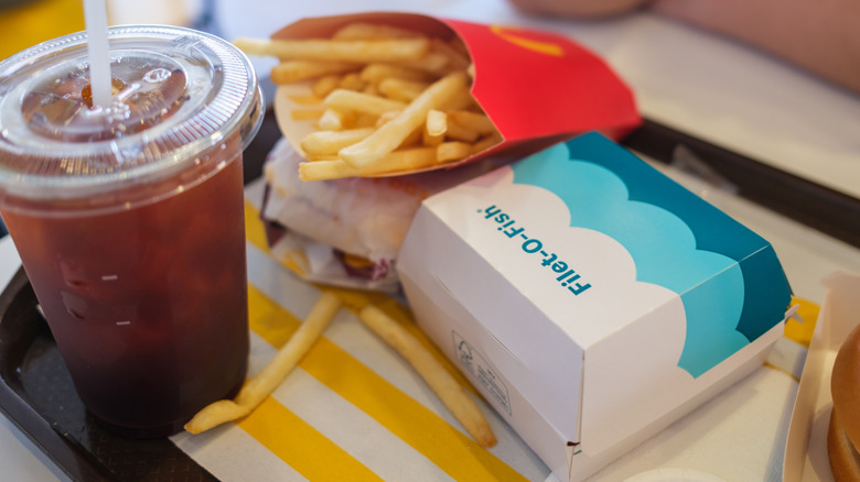 Filet-O-Fish meal with fries and drink on McDonald's tray in restaurant