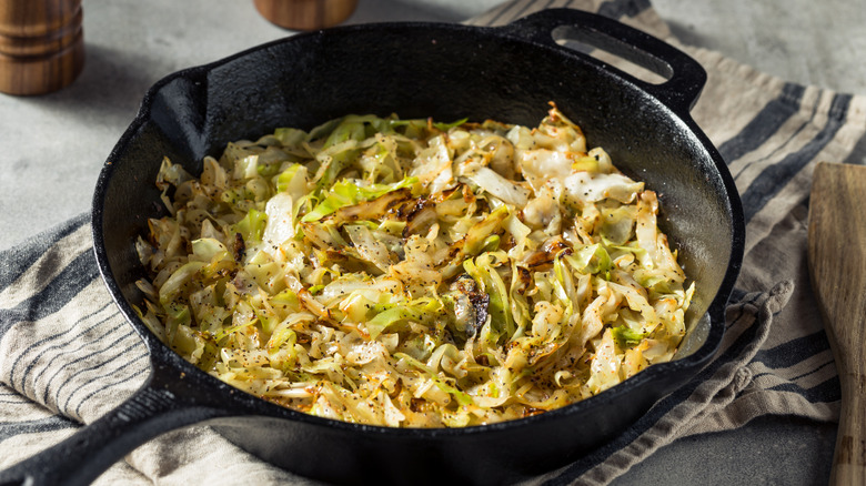 Cabbage sauteeing in a skillet