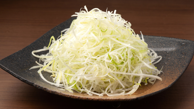 shaved onions on a plate