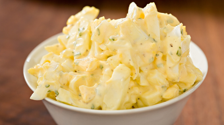 A white bowl filled with egg salad