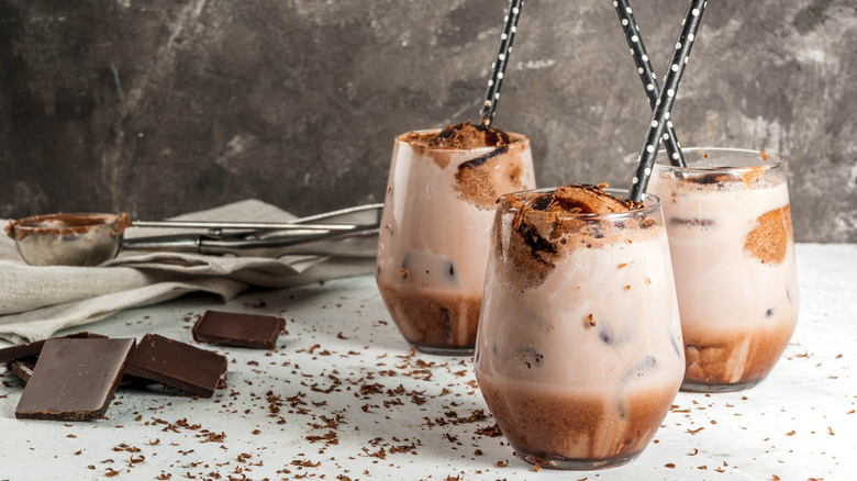 Chocolate ice cream in hot chocolate drinks with polka dot black and white straws
