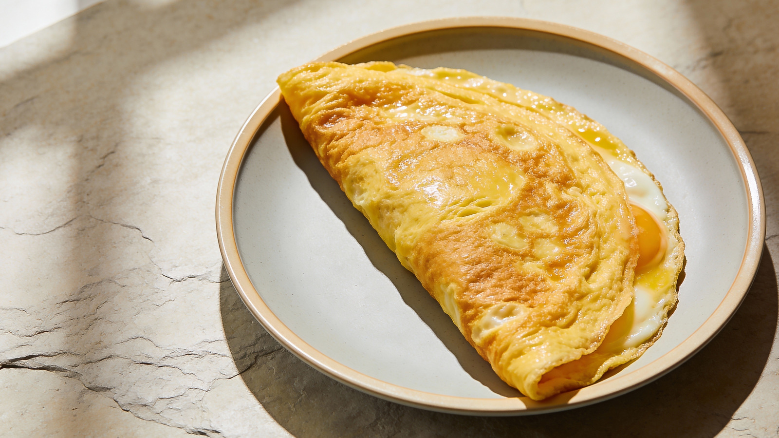 For The Most Decadent Omelet, Add A Dollop Of This Popular Cheese To The Center - Tasting Table