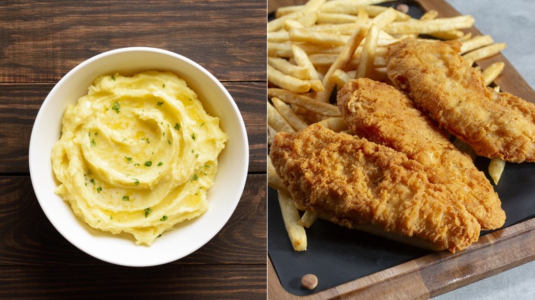 A bowl of creamy, herb-speckled garlic butter next to a plate of chicken tenders with fries