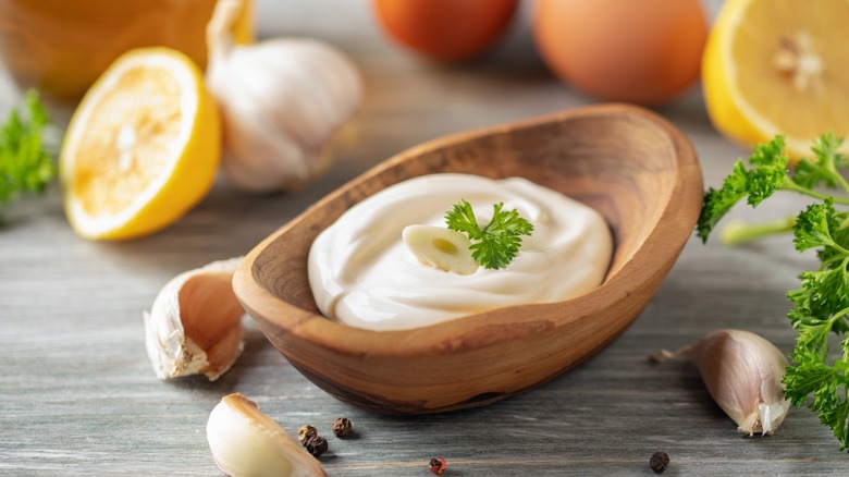 allioli garlic sauce in a mortar on a table