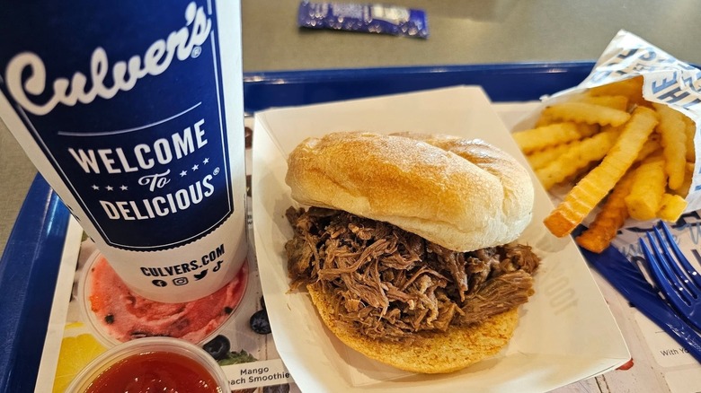 A Culver's pot roast sandwich with fries and a drink